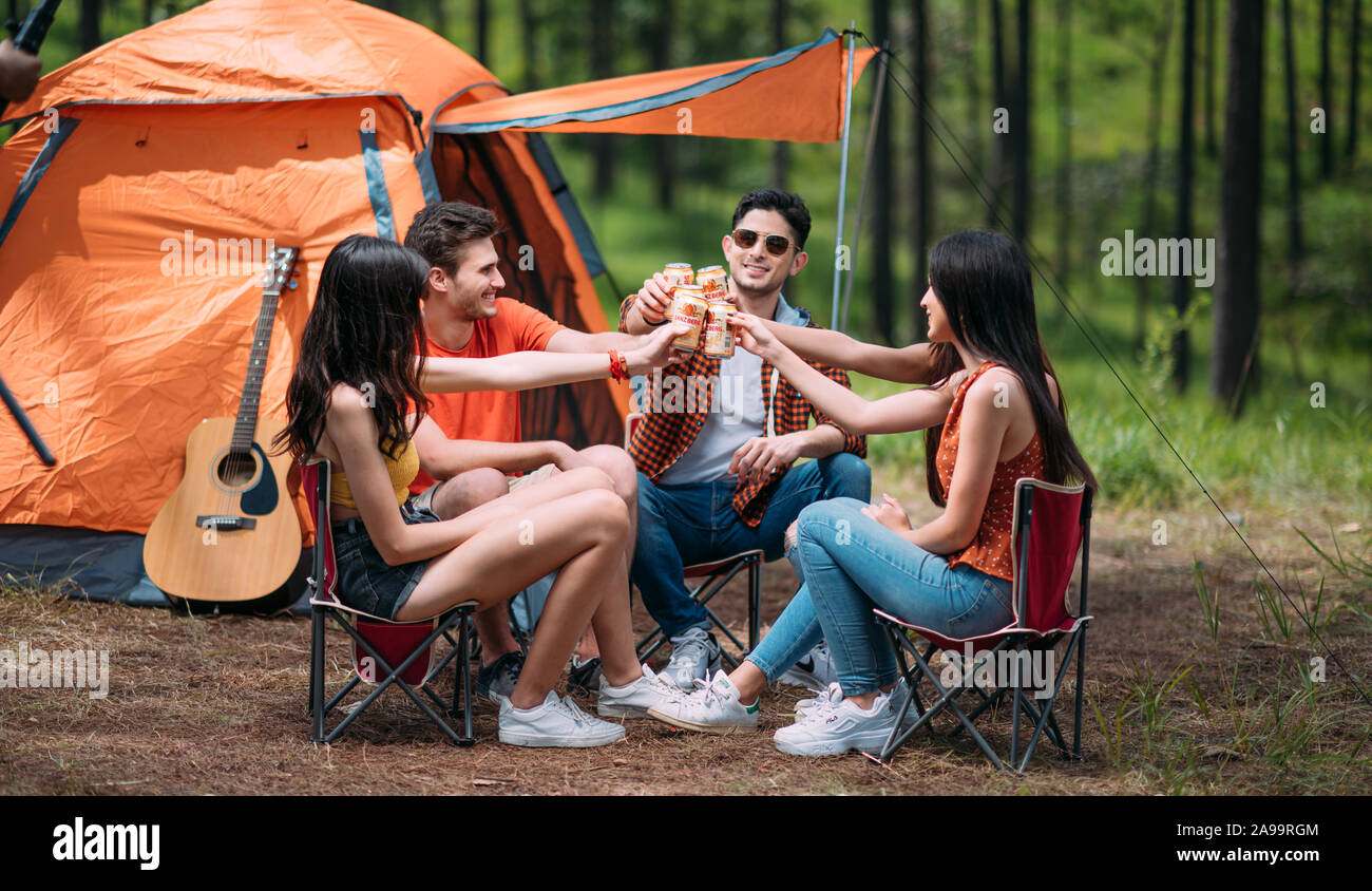 Happy Time making a Picnic Party drink ganzberg beer with Friends and Barbeque on the weekend Stock Photo
