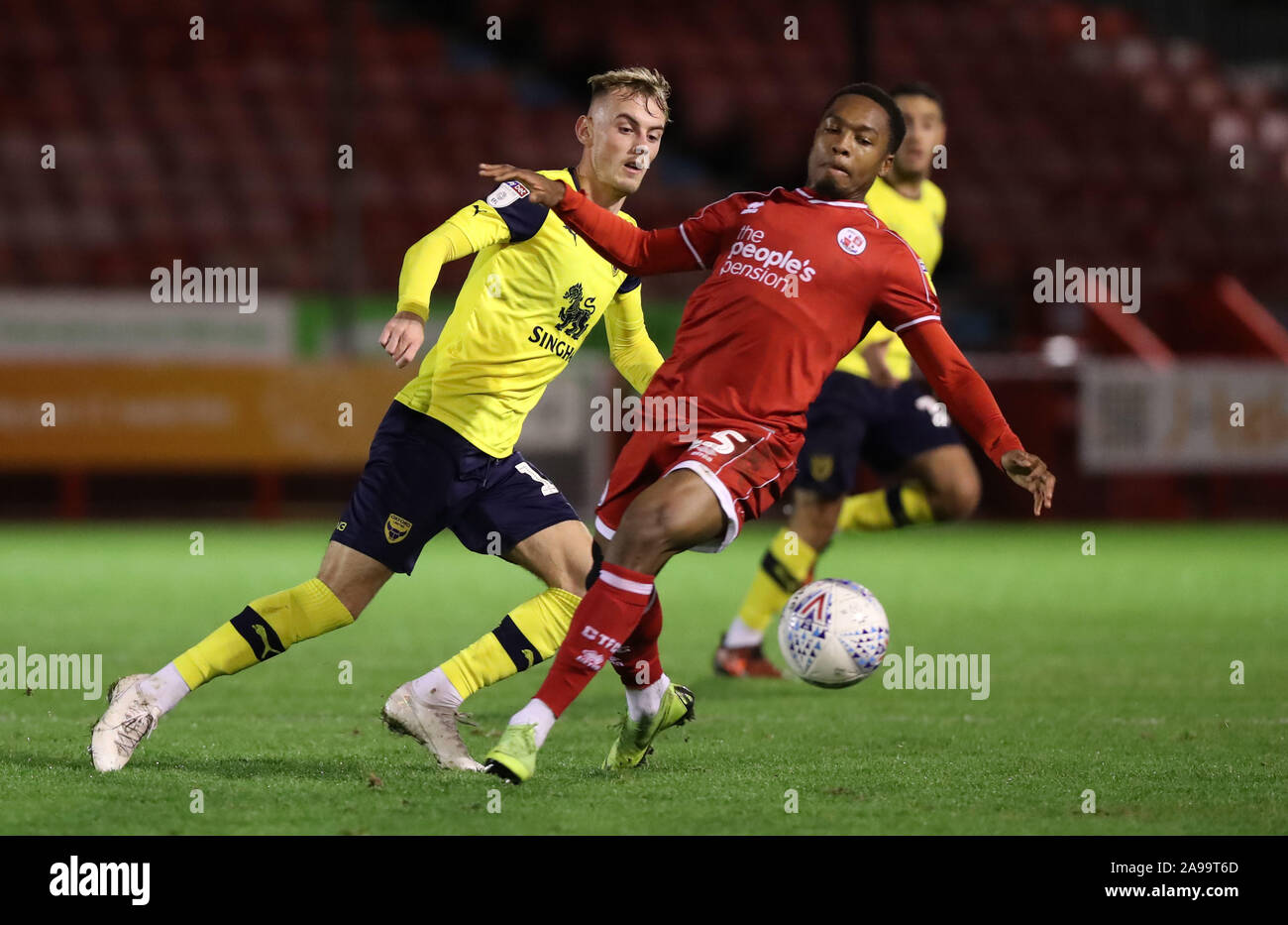Crawley Town's Ashley Nathaniel-George vies for the ball against Oxford's Mark Sykes during the Leasing.com Trophy match between Crawley Town and Oxford United at the Peoples Pension Stadium in Crawley. 12 November 2019 Stock Photo