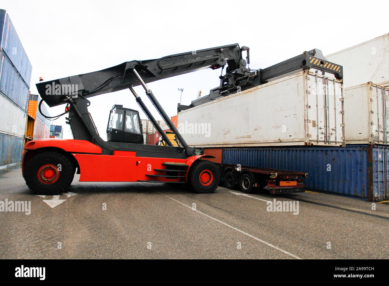 Loading and unloading of containers in the port Stock Photo - Alamy image.