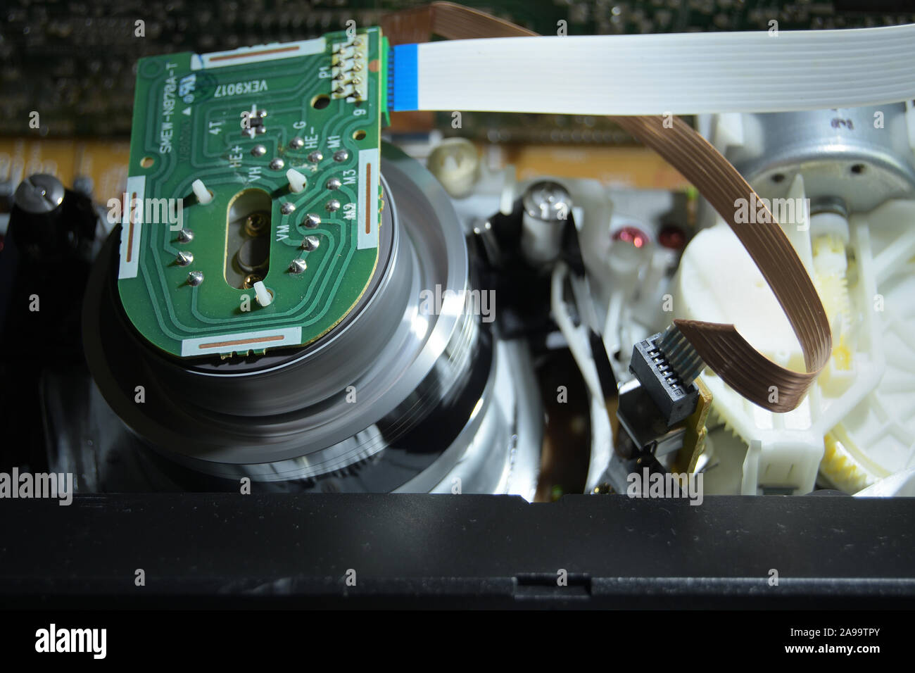 Video helical head vhs mechanism reading a video cassette tape Stock