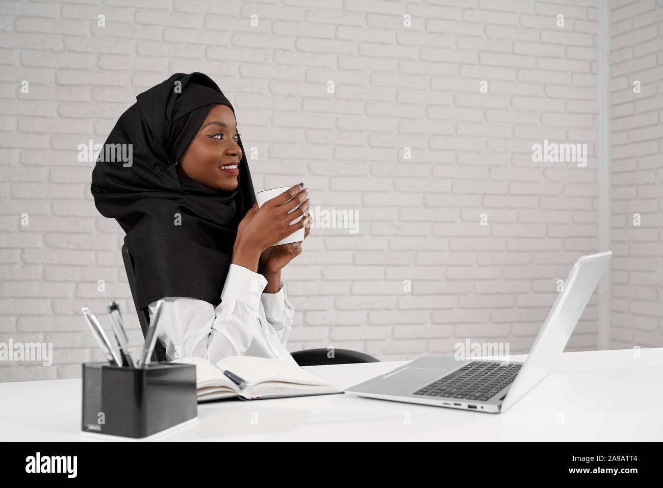 Hijab drinking hi-res stock photography and images - Alamy