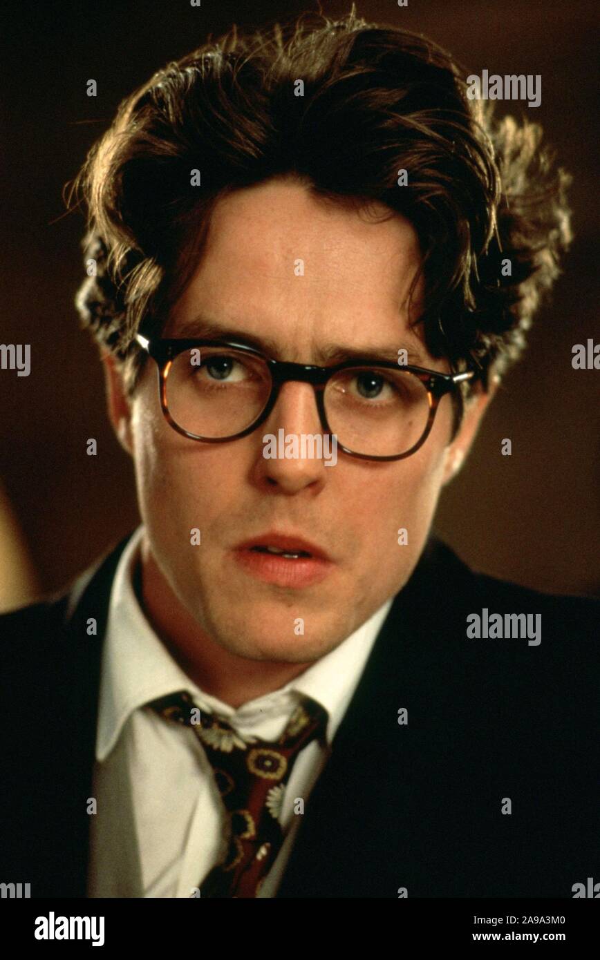 HUGH GRANT in FOUR WEDDINGS AND A FUNERAL (1994), directed by MIKE NEWELL. Credit: GRAMERCY PICTURES / Album Stock Photo
