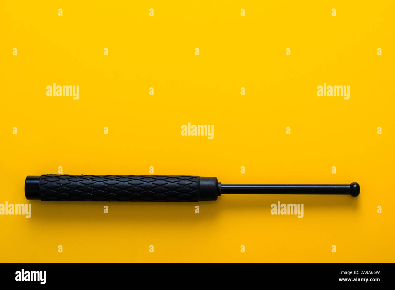 Black telescopic expandable baton / truncheon isolated Stock Photo Alamy