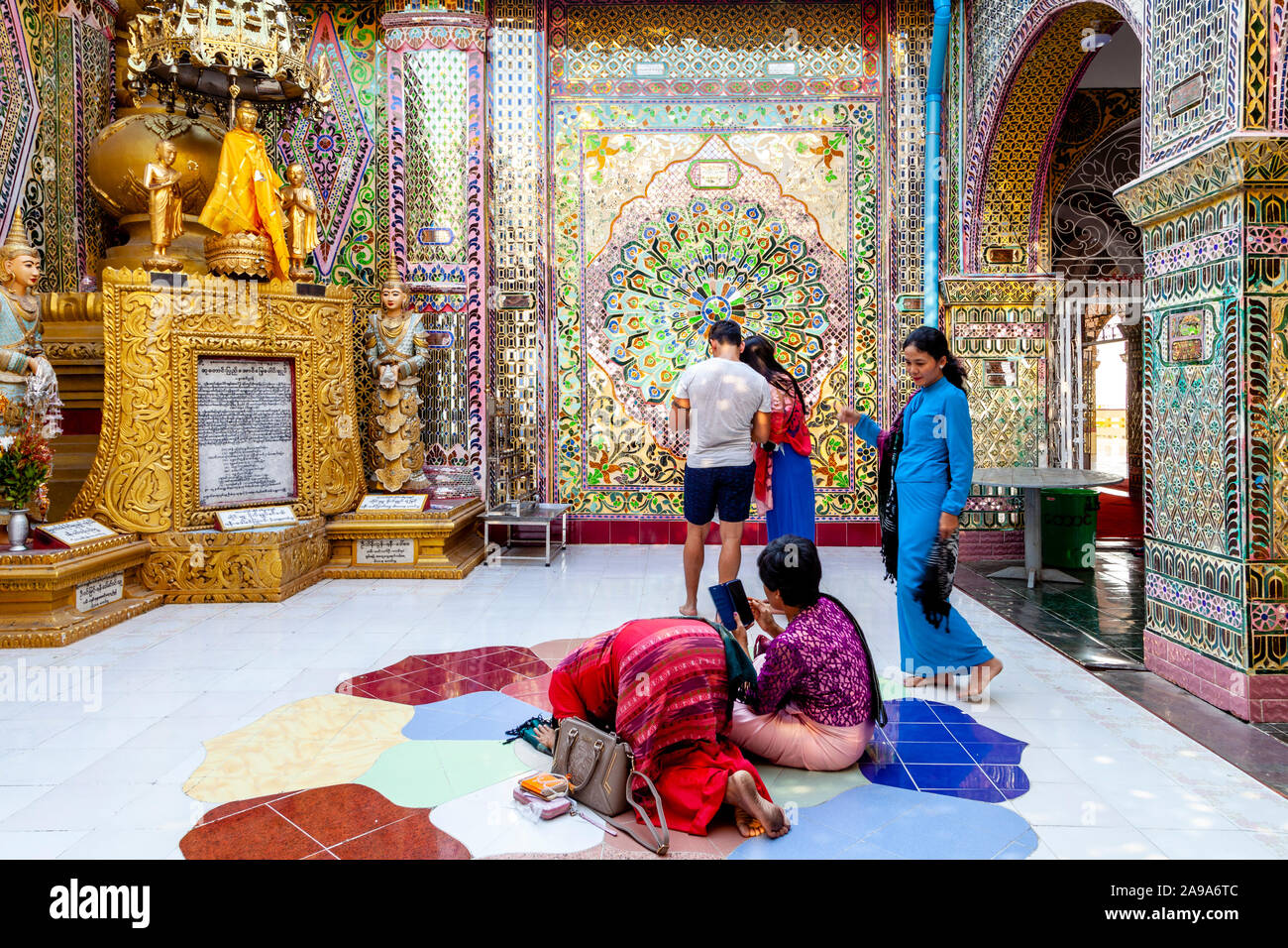 Burmese People Praying At The Su Taung Pyae Pagoda, Mandalay Hill, Mandalay, Myanmar. Stock Photo