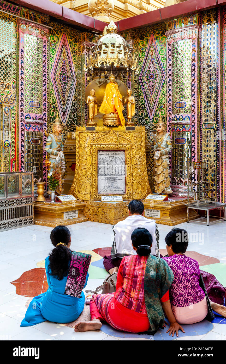 Burmese People Praying At The Su Taung Pyae Pagoda, Mandalay Hill, Mandalay, Myanmar. Stock Photo