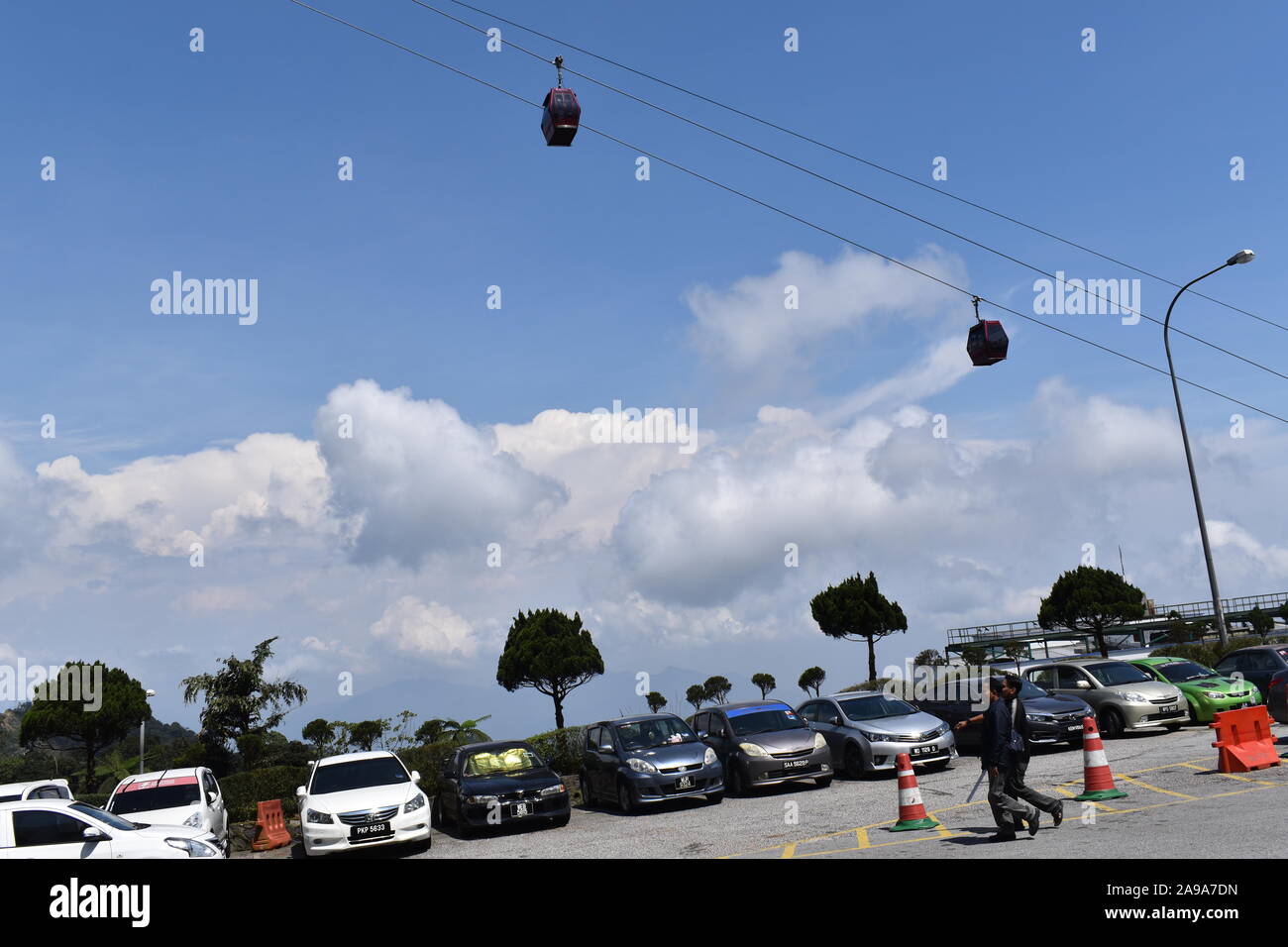 cars parked with blue sky horizon in Genting highlands Stock Photo