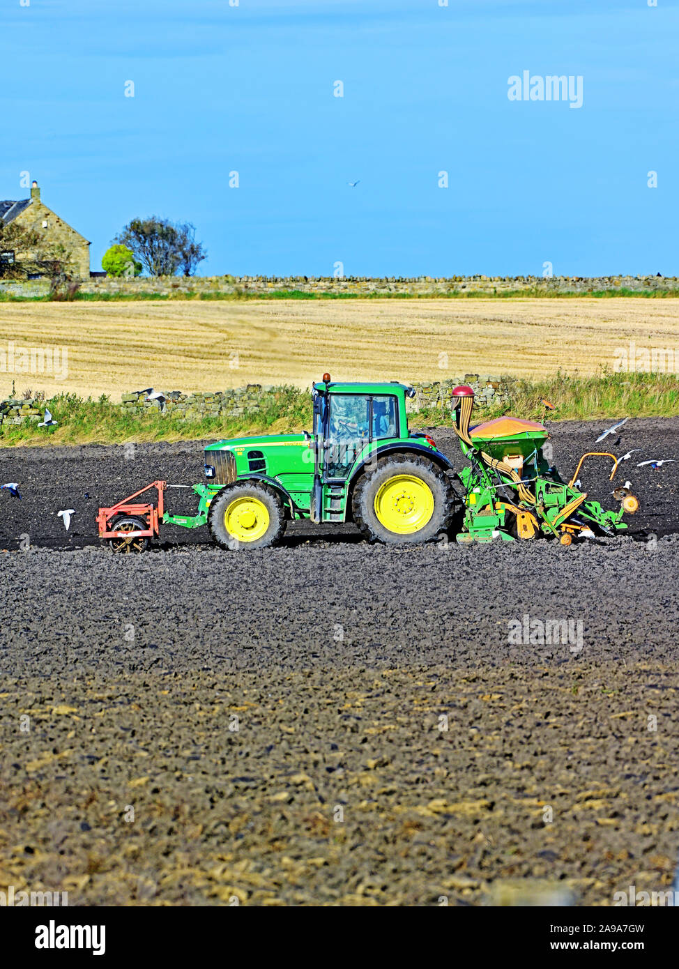 John Deere 6630 tractor tilling the autumn land Stock Photo
