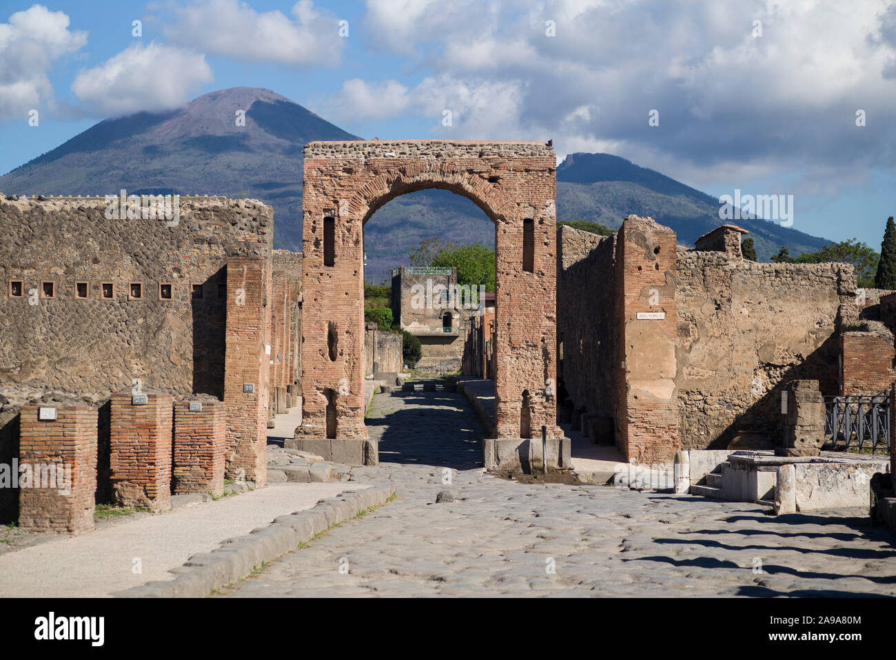 Pompei. Italy. Archaeological site of Pompeii. The so called Arch of Caligula, was the main entrance to Via di Mercurio.  View towards Via di Mercurio Stock Photo