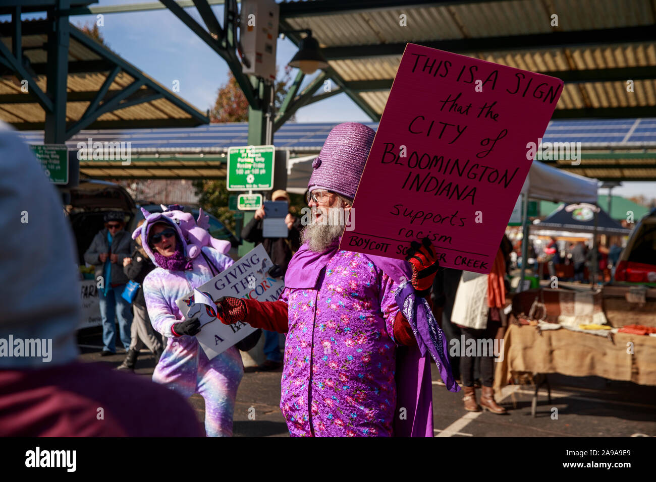 Bloomington, United States. 09th Nov, 2019. A protester holds a placard while chanting slogans during the demonstration.police arrested activists dressed as a giant unicorn, Wonder Woman and Vikings after they demonstrated at a farmers' market in Indiana against 'white supremacy.' The Purple Shirt Brigade is an activist coalition formed this year in Bloomington that wears purple to represent their public stand against white supremacy. Credit: SOPA Images Limited/Alamy Live News Stock Photo
