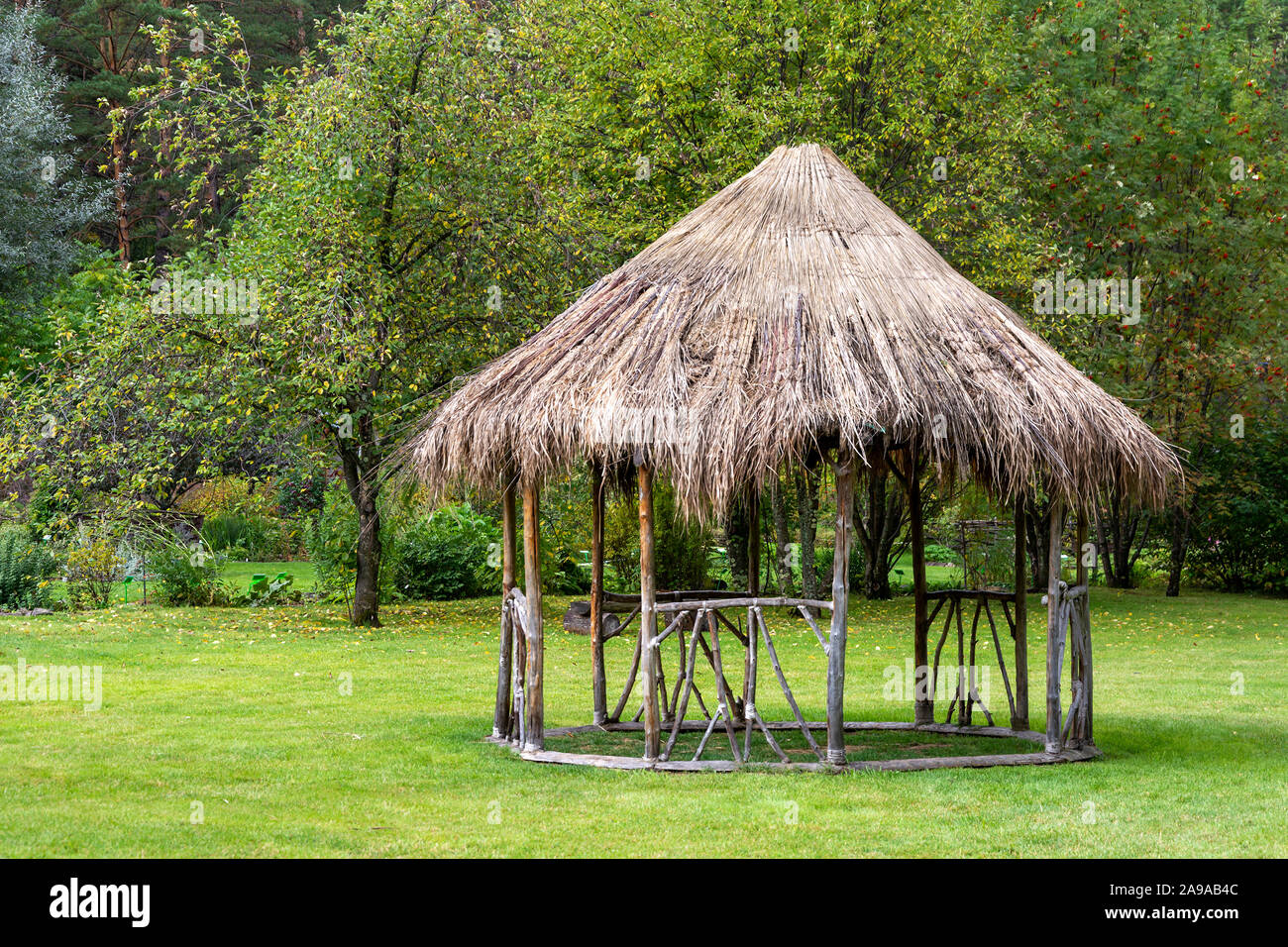 Gazebo at the far end of the garden near the forest, in early autumn Stock Photo