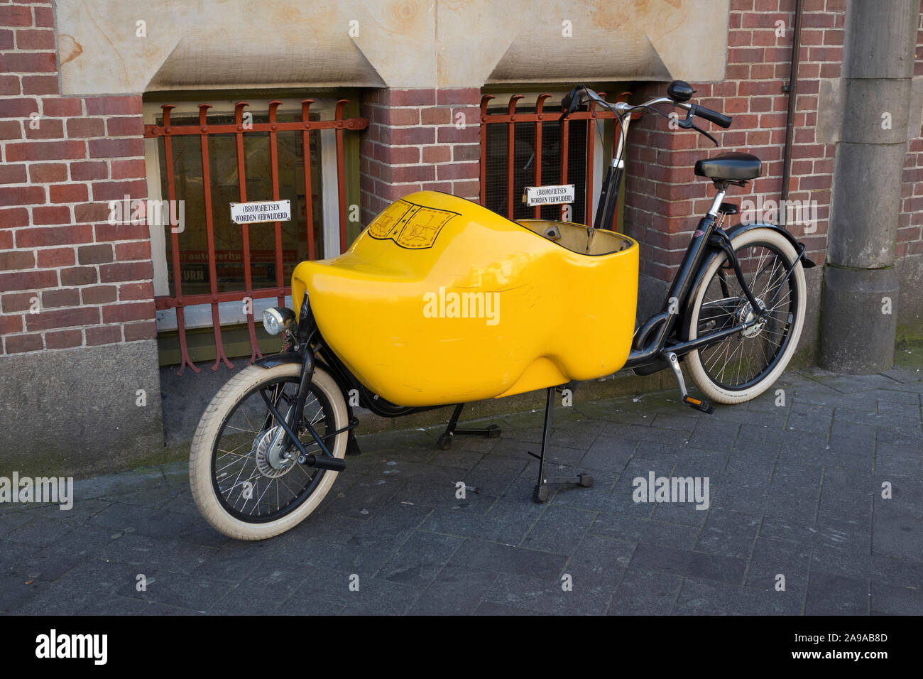 Amsterdam, Holland - October 30, 2019: Parked cargo bike in the shape of a traditional Dutch wooden shoe Stock Photo