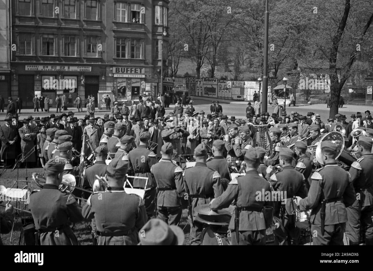 Original caption: German soldiers giving a concert in the streets of Prague on Sunday, 1930s Stock Photo