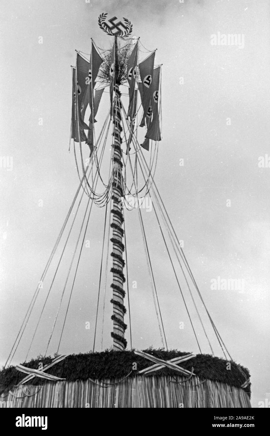 Maypole with swastika flags, 1930s Stock Photo