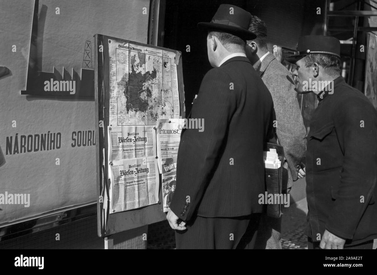 Original caption: Czechs study the language map of Germany in front of a Czech bookstore, Prague 1930s Stock Photo