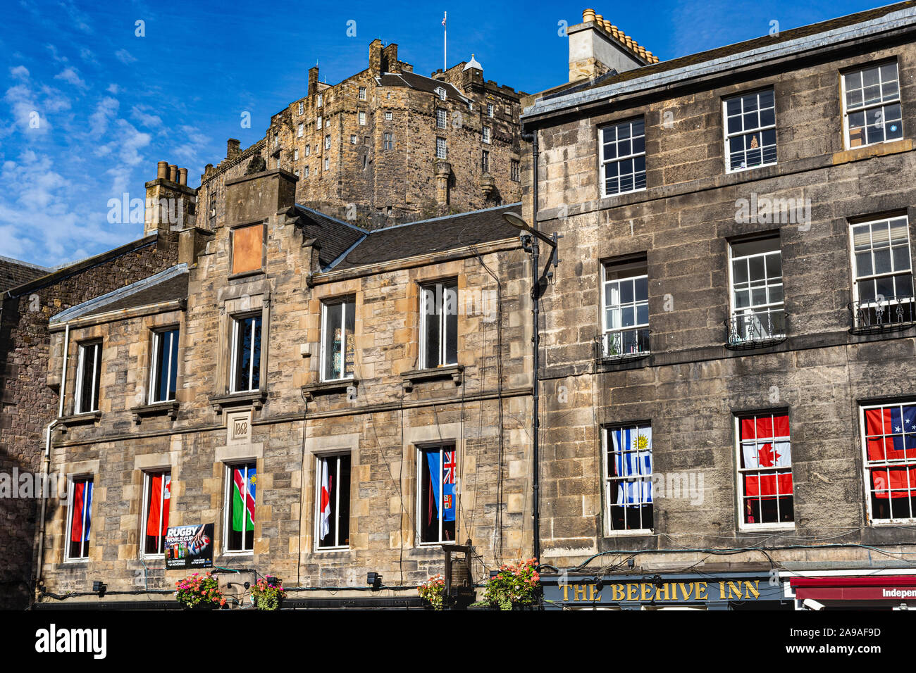 Detail of Historic Buildings in the Grassmarket With Clear Skyline View of Edinburgh Castle With Blue Sky: Edinburgh, Scotland. Stock Photo