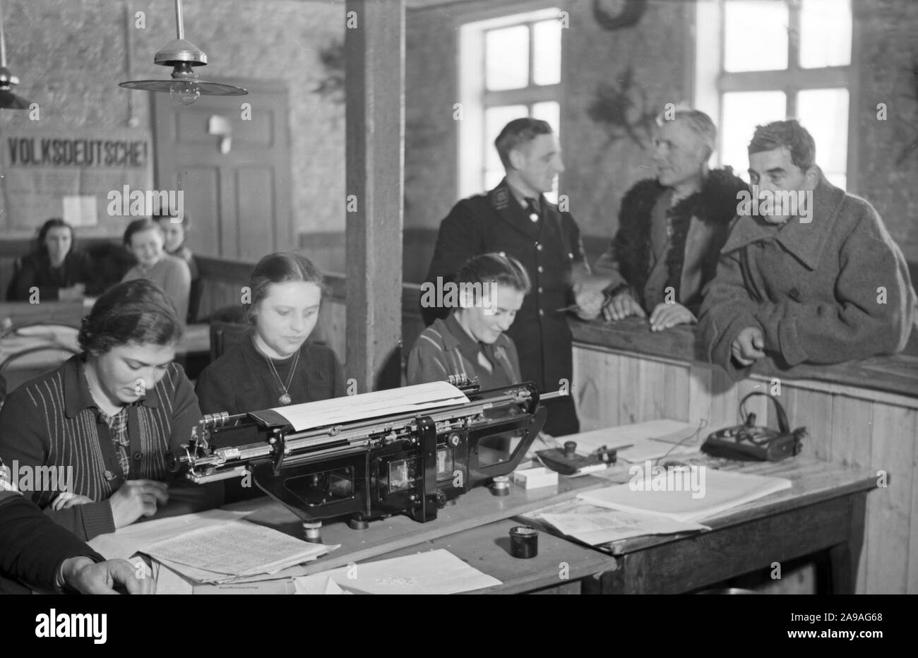 At the office of a refugee camp for 'Volksdeutsche' refugees, Germany 1940s. Stock Photo