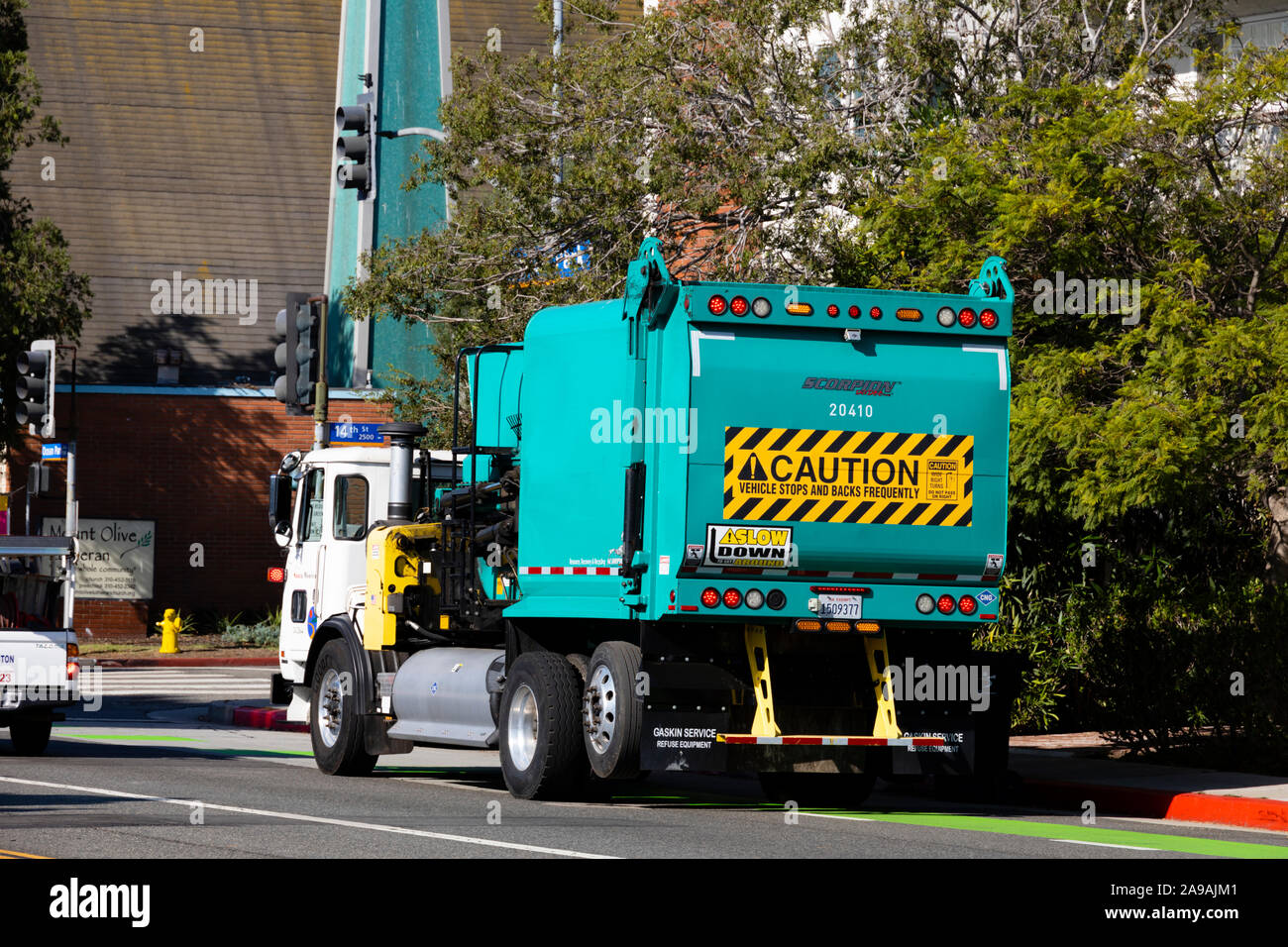 Automated garbage collection vehicle at work, Ocean Park Boulevard, Santa Monica, California, United States of America. USA Stock Photo