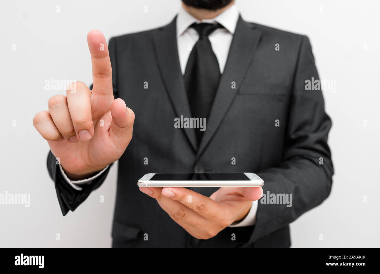 Male human wear formal work suit hold smart hi tech smartphone use one ...