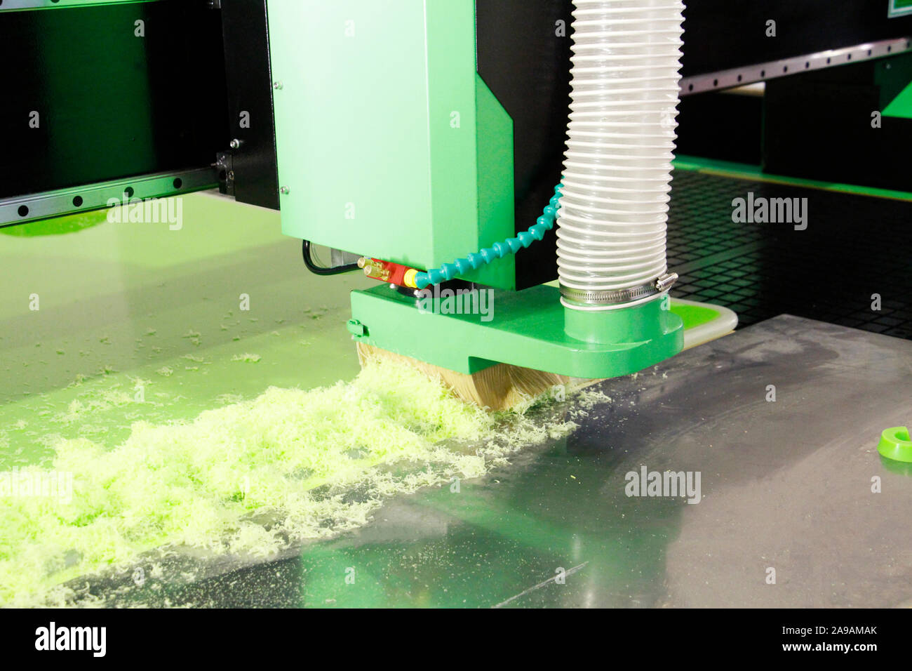 Plexiglass milling on CNC machines. A modern CNC machine processes acrylic at a furniture factory. Plexiglass processing on the CNC wall. Modern 3D te Stock Photo