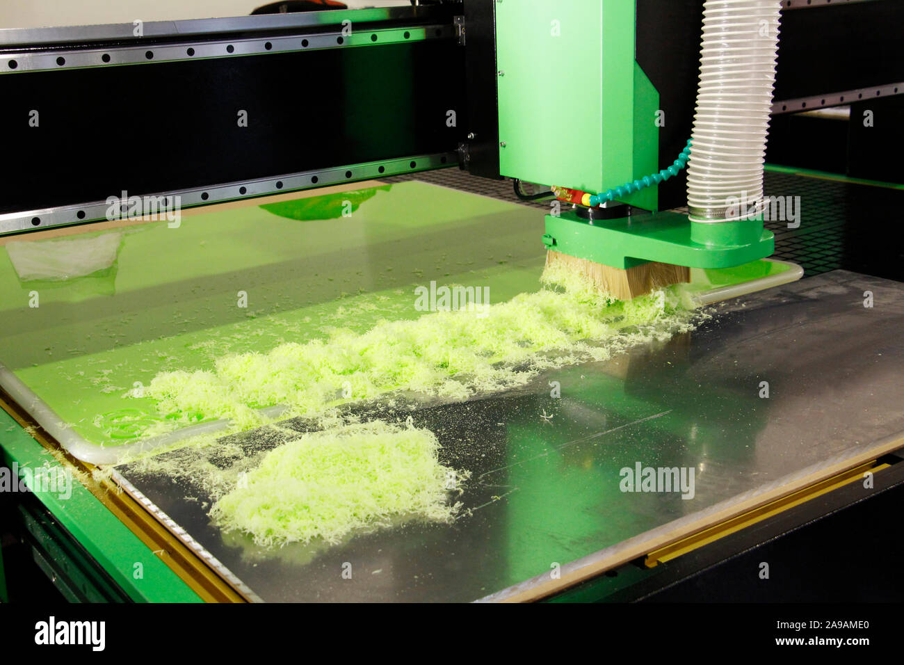 Plexiglass milling on CNC machines. A modern CNC machine processes acrylic at a furniture factory. Plexiglass processing on the CNC wall. Modern 3D te Stock Photo