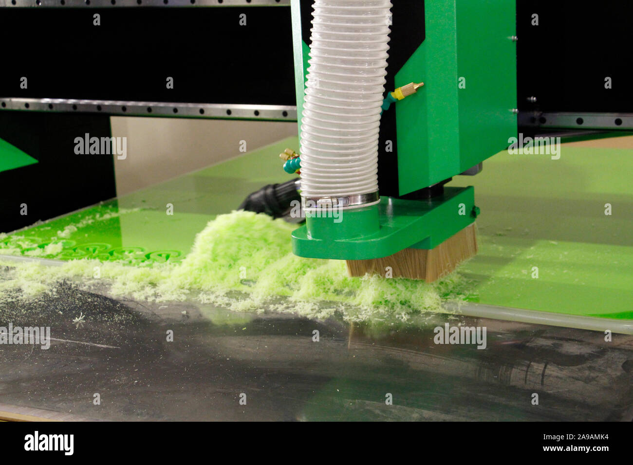 Plexiglass milling on CNC machines. A modern CNC machine processes acrylic at a furniture factory. Plexiglass processing on the CNC wall. Modern 3D te Stock Photo