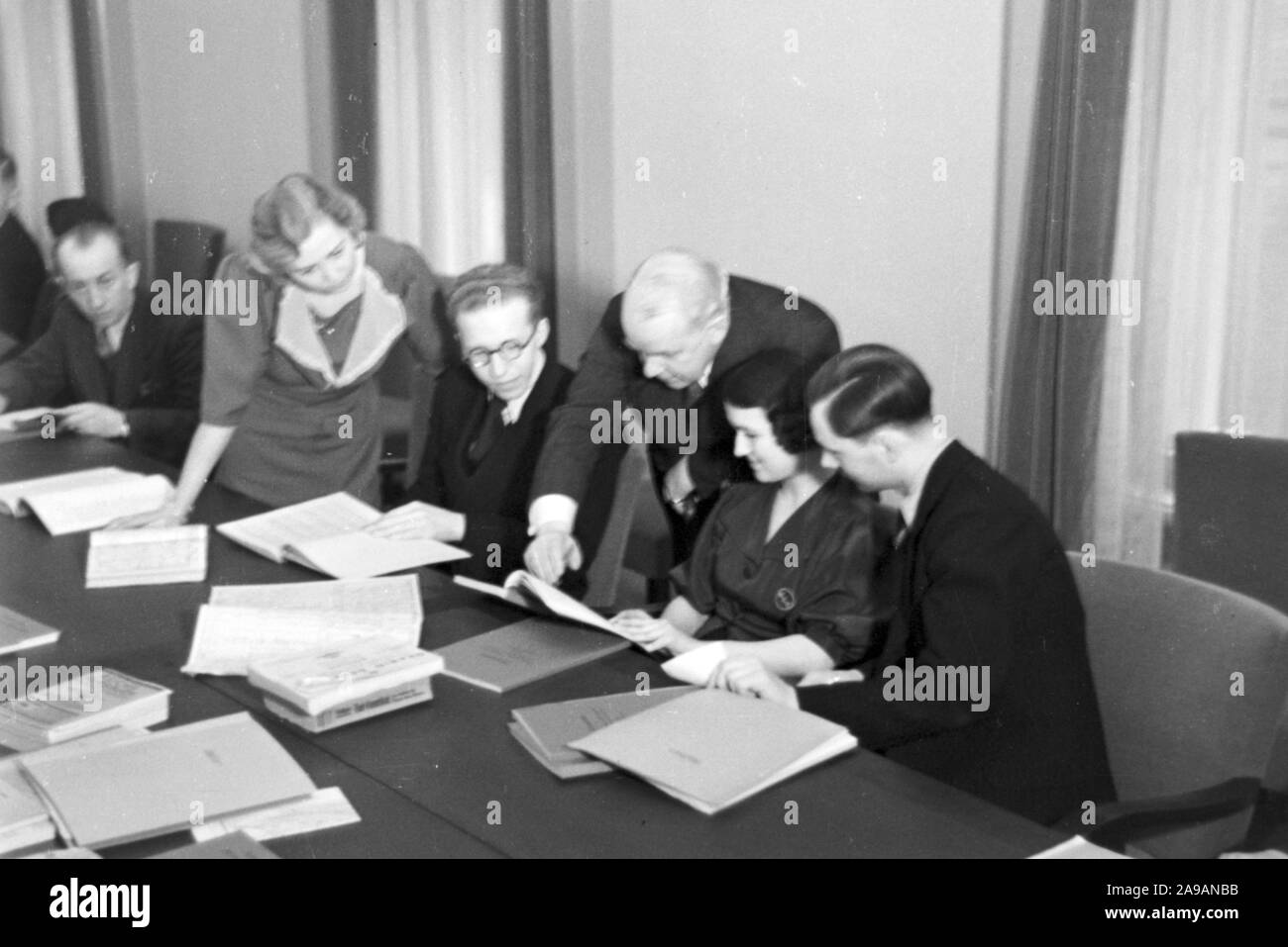Travellers And Staff Members At A Huge Office Of A Travel Agency