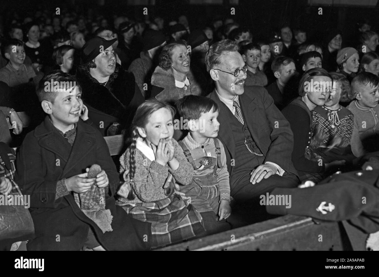 The audience enjoying a play of the Cologne Puppet Theatre, Germany