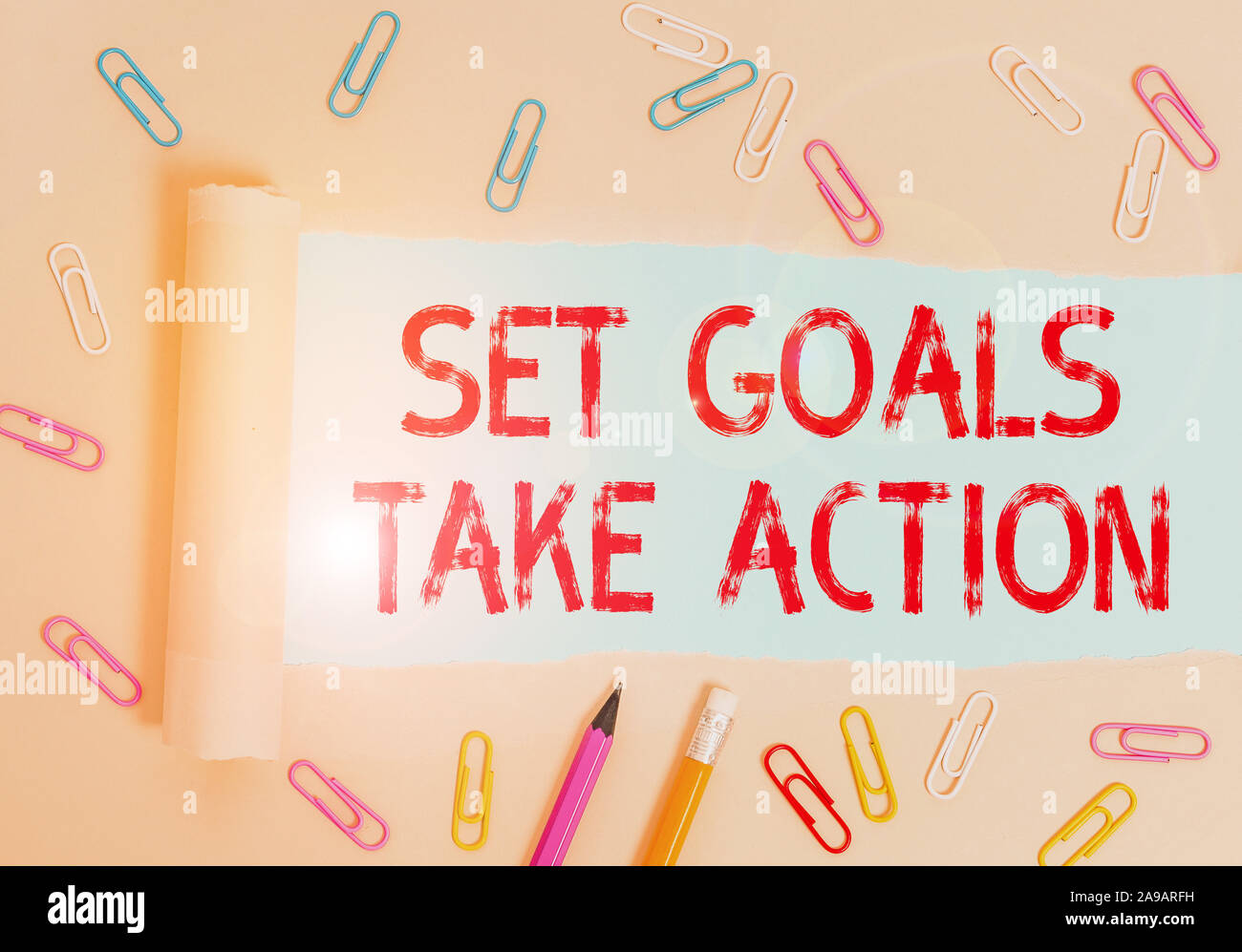Writing note showing Set Goals Take Action. Business concept for Act on a specific and clearly laid out plans Stationary and torn cardboard placed abo Stock Photo