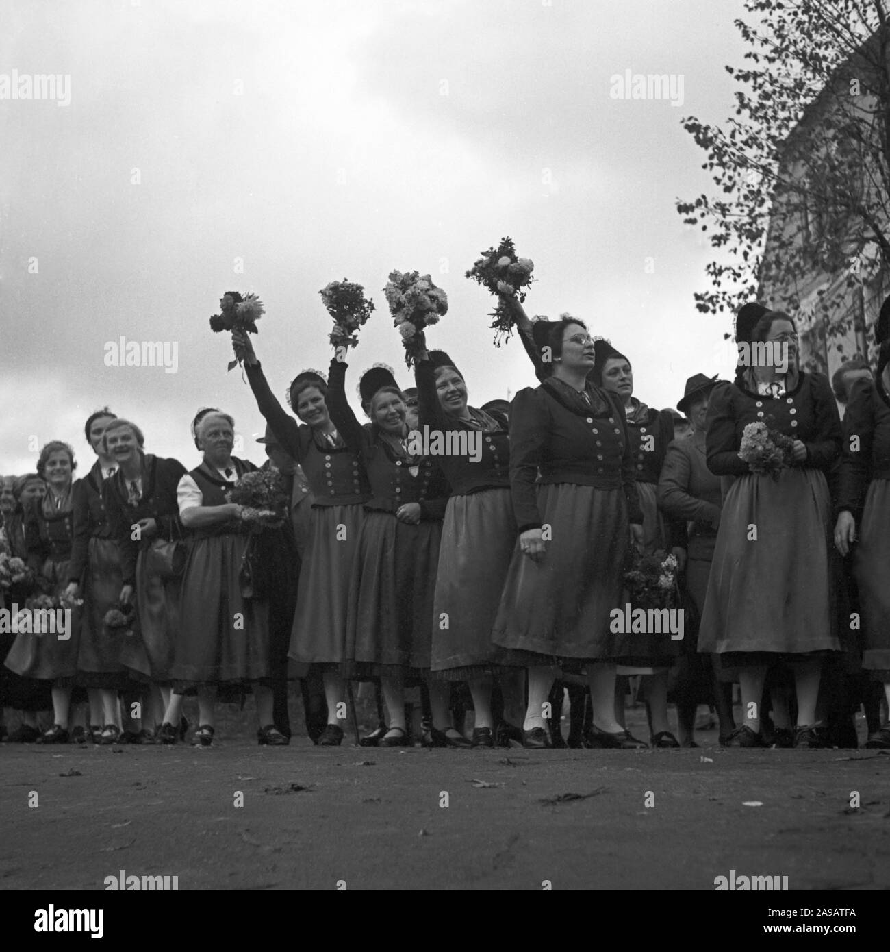 Women in array cheering to Fuehrer and chancellor Adolf Hitler visiting the city of Asch in Sudetenland county, Germany 1930s. Stock Photo