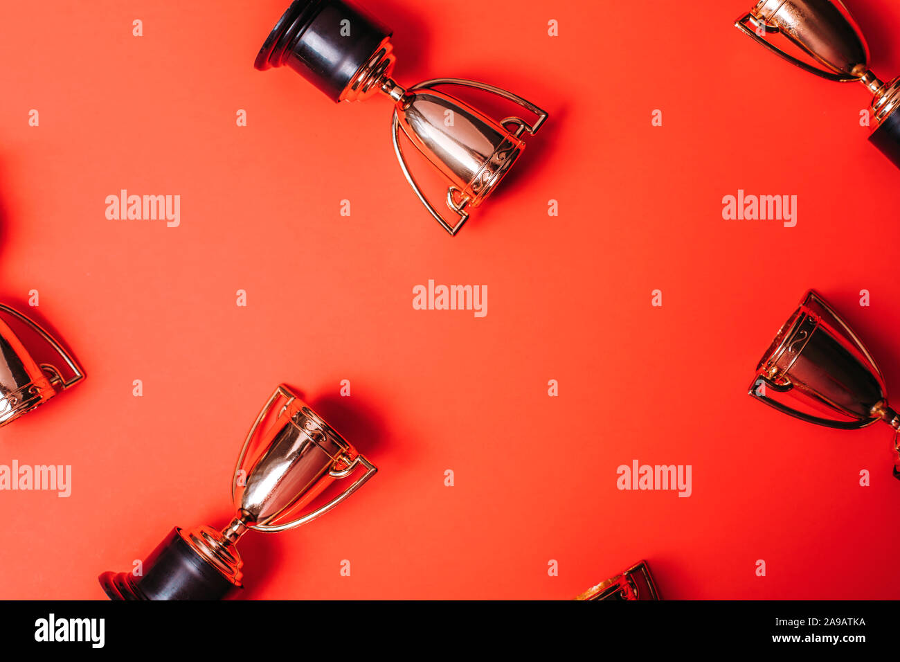 Winner or champion cup on bright background, Flat lay style. Open composition. Stock Photo