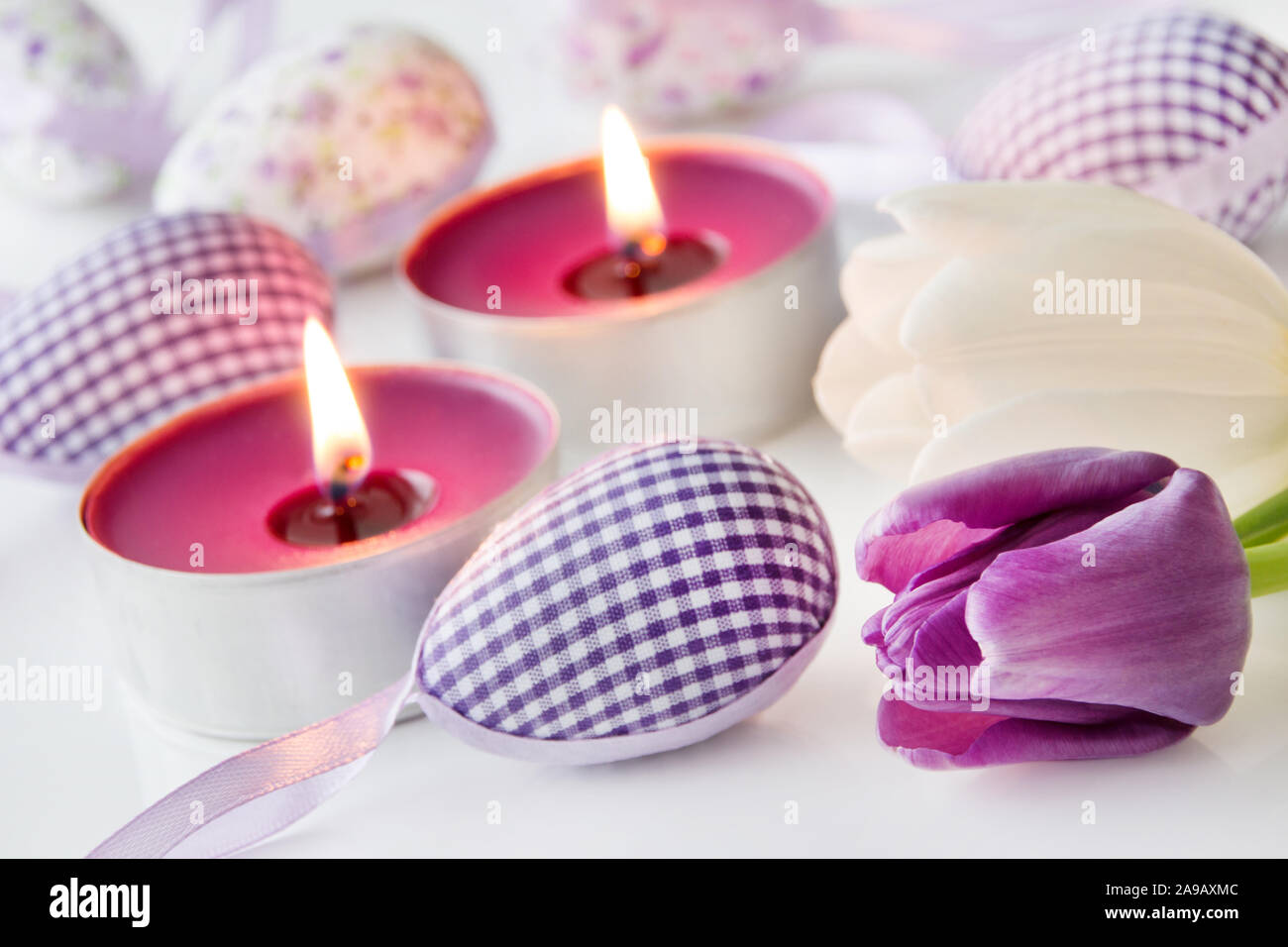 Easter decoration eggs and candles Stock Photo