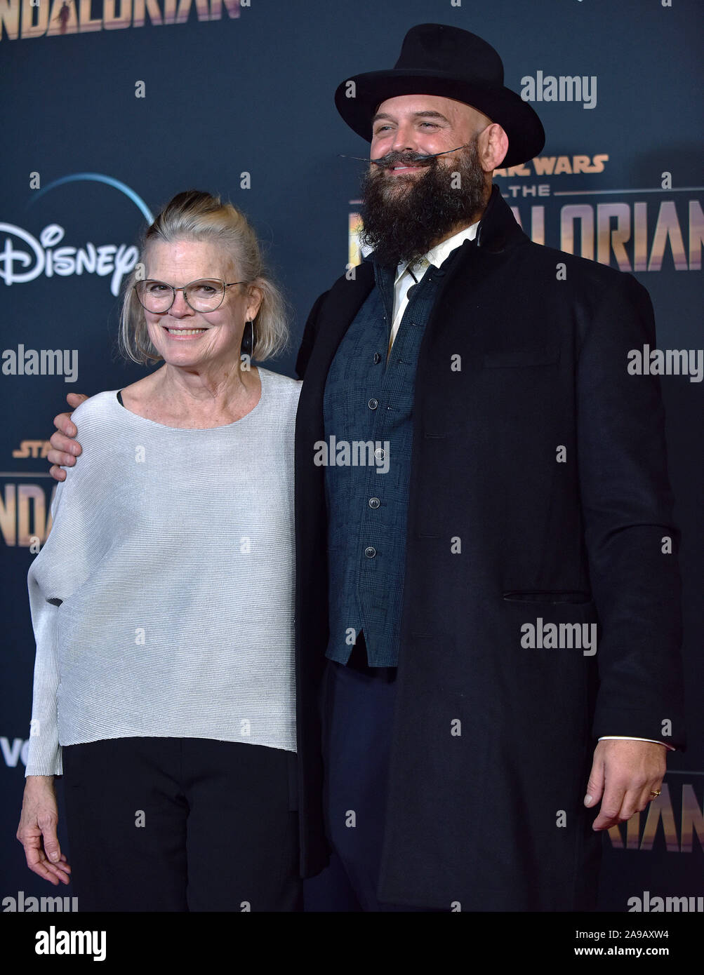 Tait Fletcher (R) arrives for the premiere of Disney+'s 'The