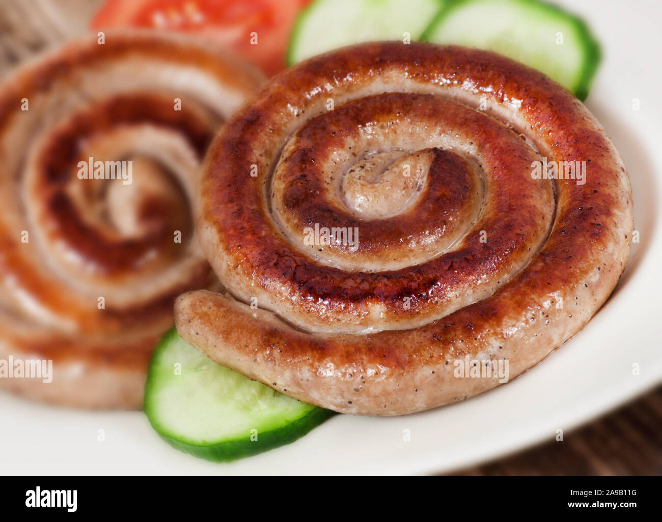 Fried sausage and salad close up Stock Photo
