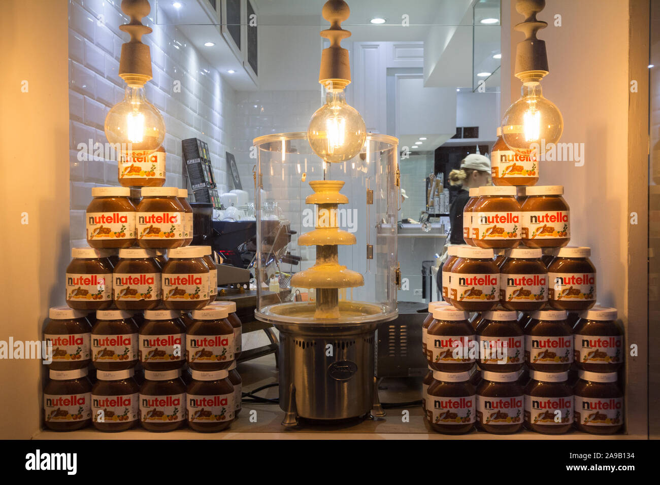 VIENNA, AUSTRIA - NOVEMBER 6, 2019: Nutella Jars piled with their logo on display in a retailer in Vienna. Nutella is a hazelnut and cocoa spread prod Stock Photo