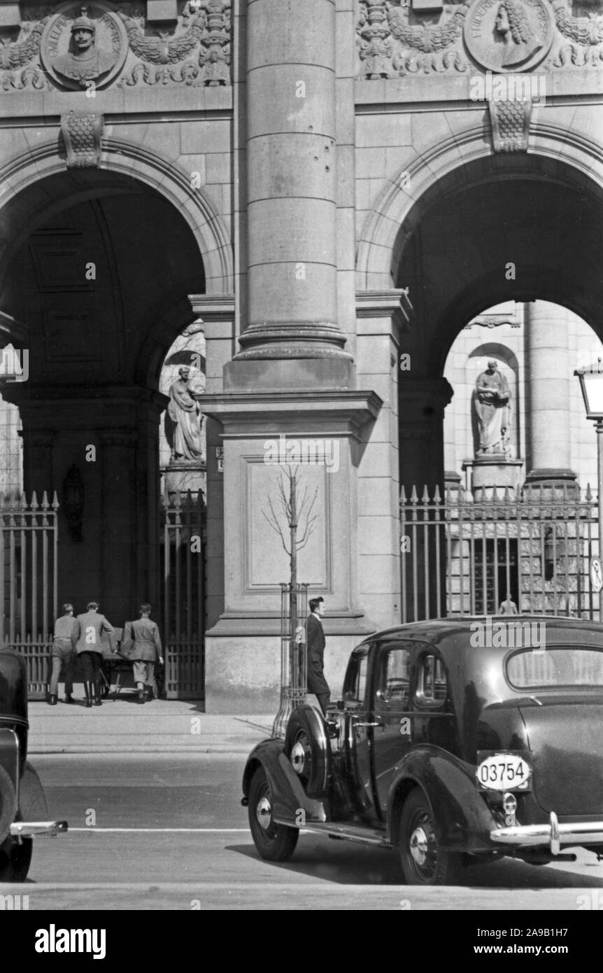 Taking a walk through Berlin, here: front of royal library, Germany 1930s. Stock Photo