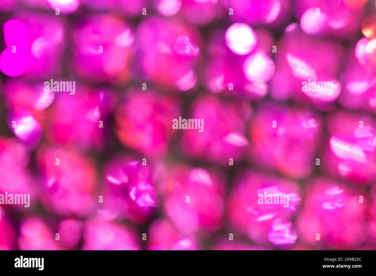 Fabric warm purple pink textile material texture pattern blur background. Stock Photo
