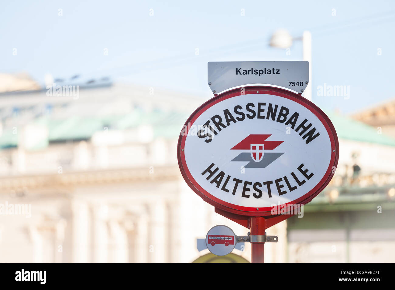 VIENNA, AUSTRIA - NOVEMBER 6, 2019: Logo of Wiener Linien on a local tram stop (Strassenbahn Haltestelle) on Karlsplatz in Vienna. Wiener Linien is th Stock Photo