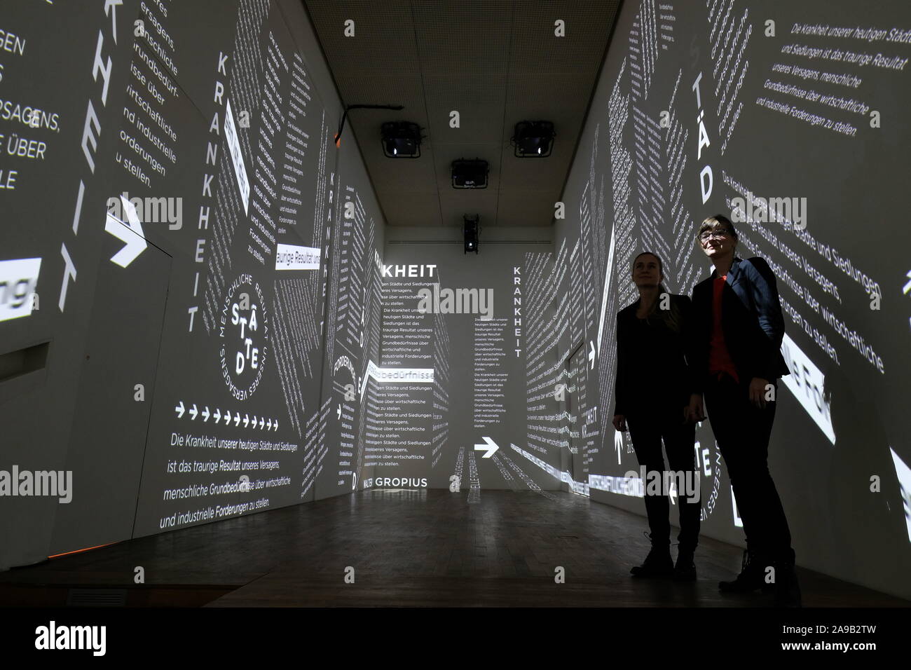 Halle, Germany. 14th Nov, 2019. The artists Claudia Dölling (l) and Anja Krämer stand in the rooms of the Kunststiftung Sachsen-Anhalt, while their media installation 'Typo Utopia' is projected. The presentation on the occasion of the 100th anniversary of the Bauhaus can be seen from 20.12 to 22.12.2019. Credit: Sebastian Willnow/dpa-Zentralbild/ZB/dpa/Alamy Live News Stock Photo
