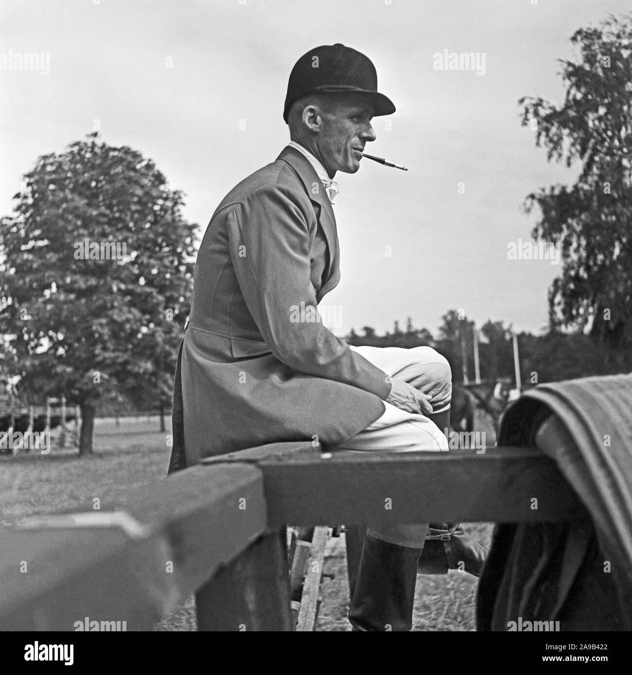A young man wearing a jacket for an tournament in equestrian sports, Germany 1957 Stock Photo