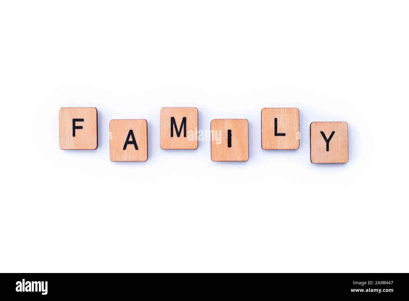 The word FAMILY, spelt with wooden letter tiles Stock Photo - Alamy