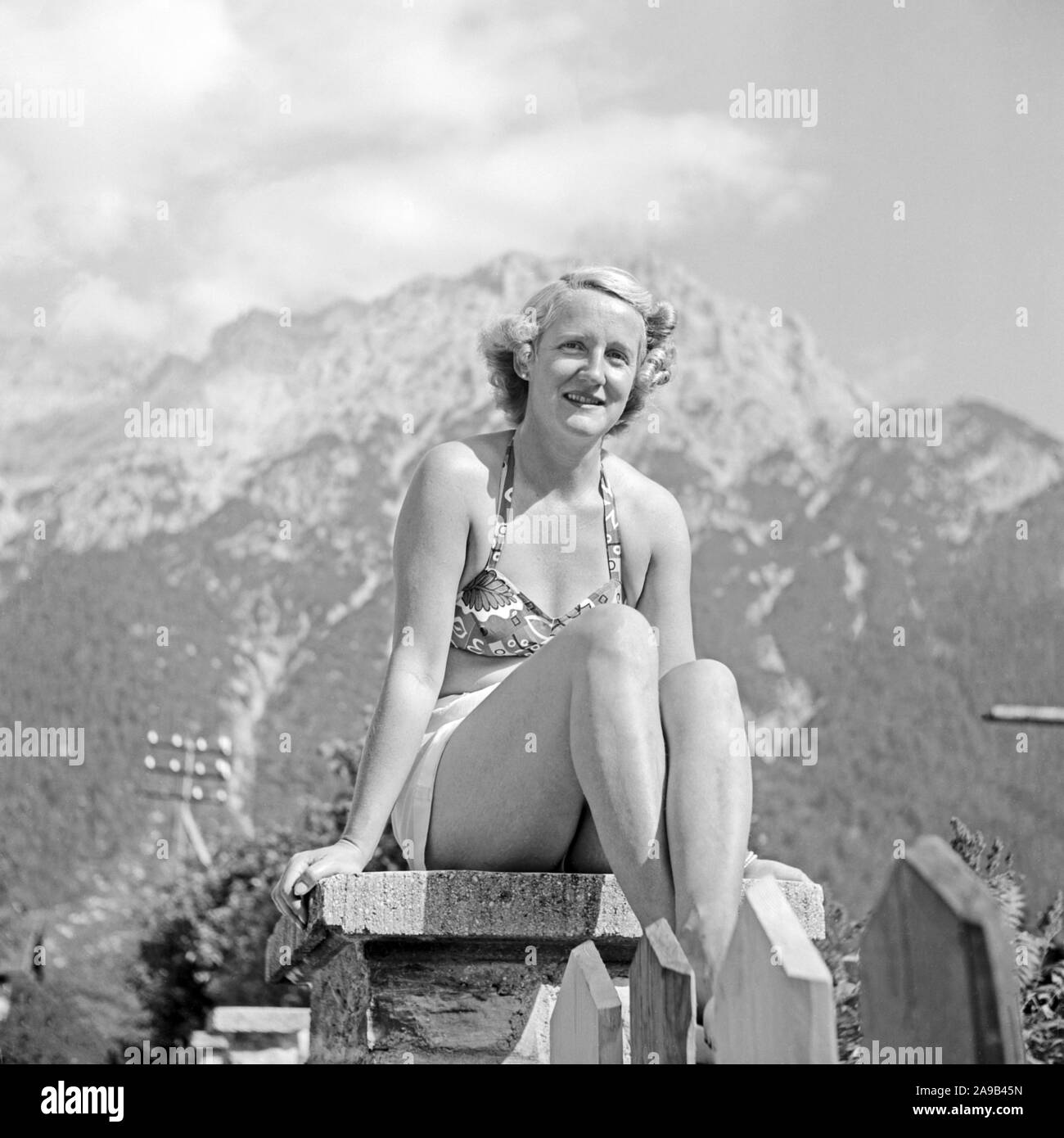 A woman spending the day at Lautersee lake near Mittenwald, Germany 1955 Stock Photo