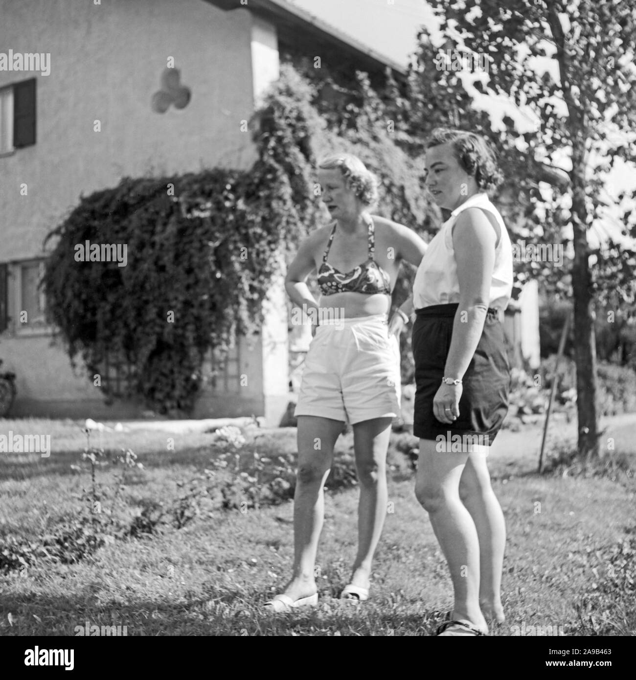 Two women spending the day at Lautersee lake near Mittenwald, Germany 1955 Stock Photo