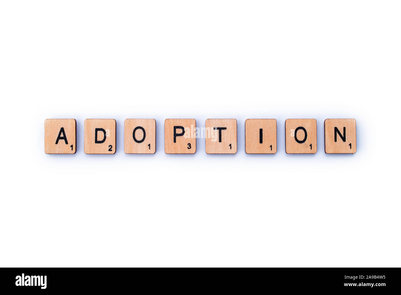 London, UK - February 6th 2019: The word ADOPTION, spelt out with wooden letter tiles. Stock Photo