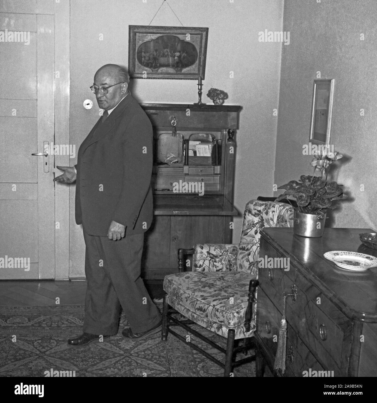 Man at the living room, Germany 1950s. Stock Photo