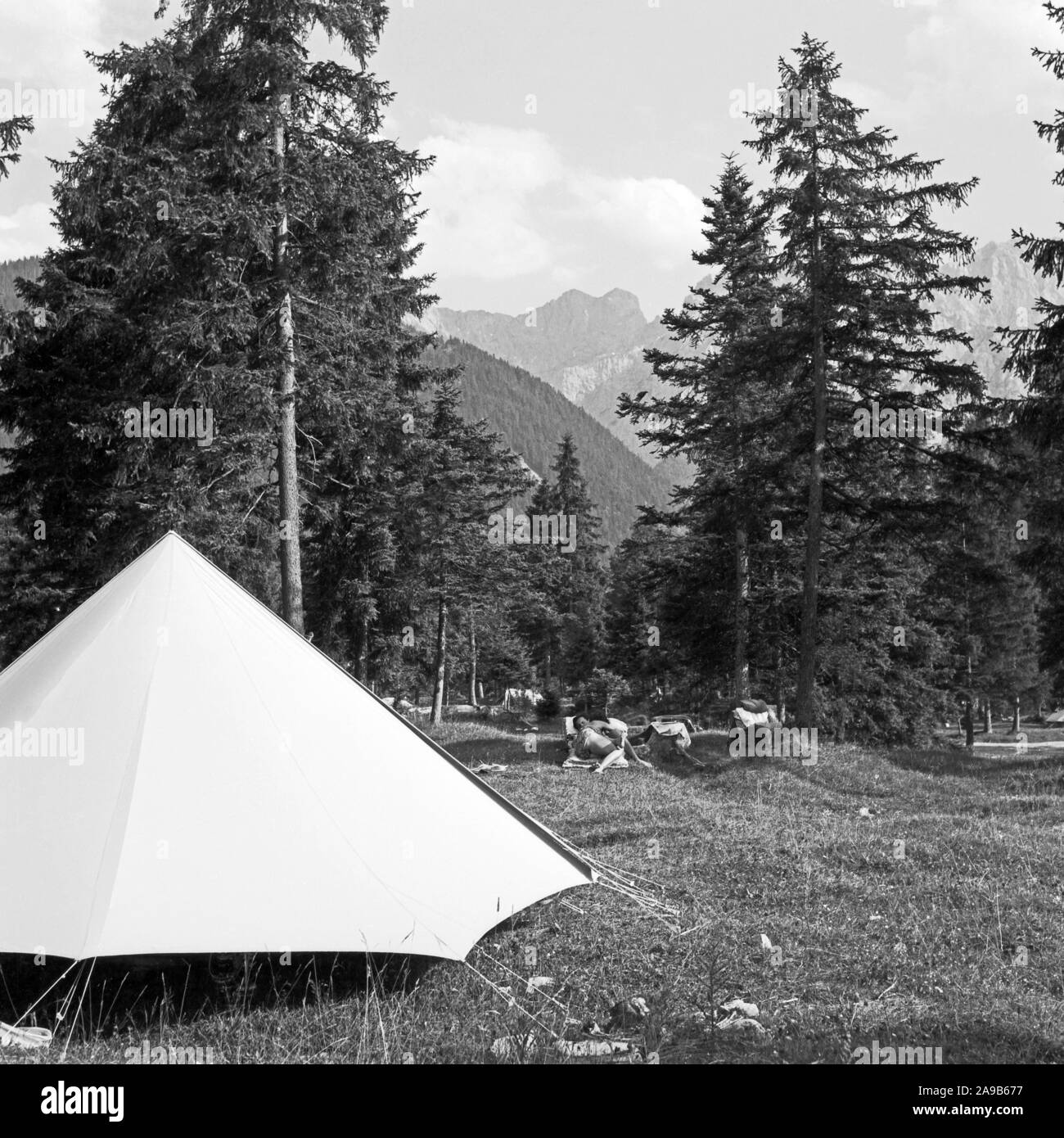 Camping tent with mountain rainge, Germany 1958 Stock Photo Alamy