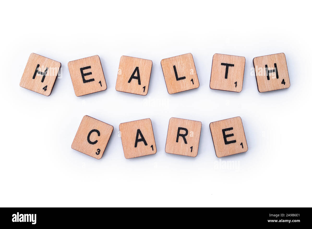 London, UK - February 6th 2019: HEALTH CARE, spelt with wooden letter tiles. Stock Photo