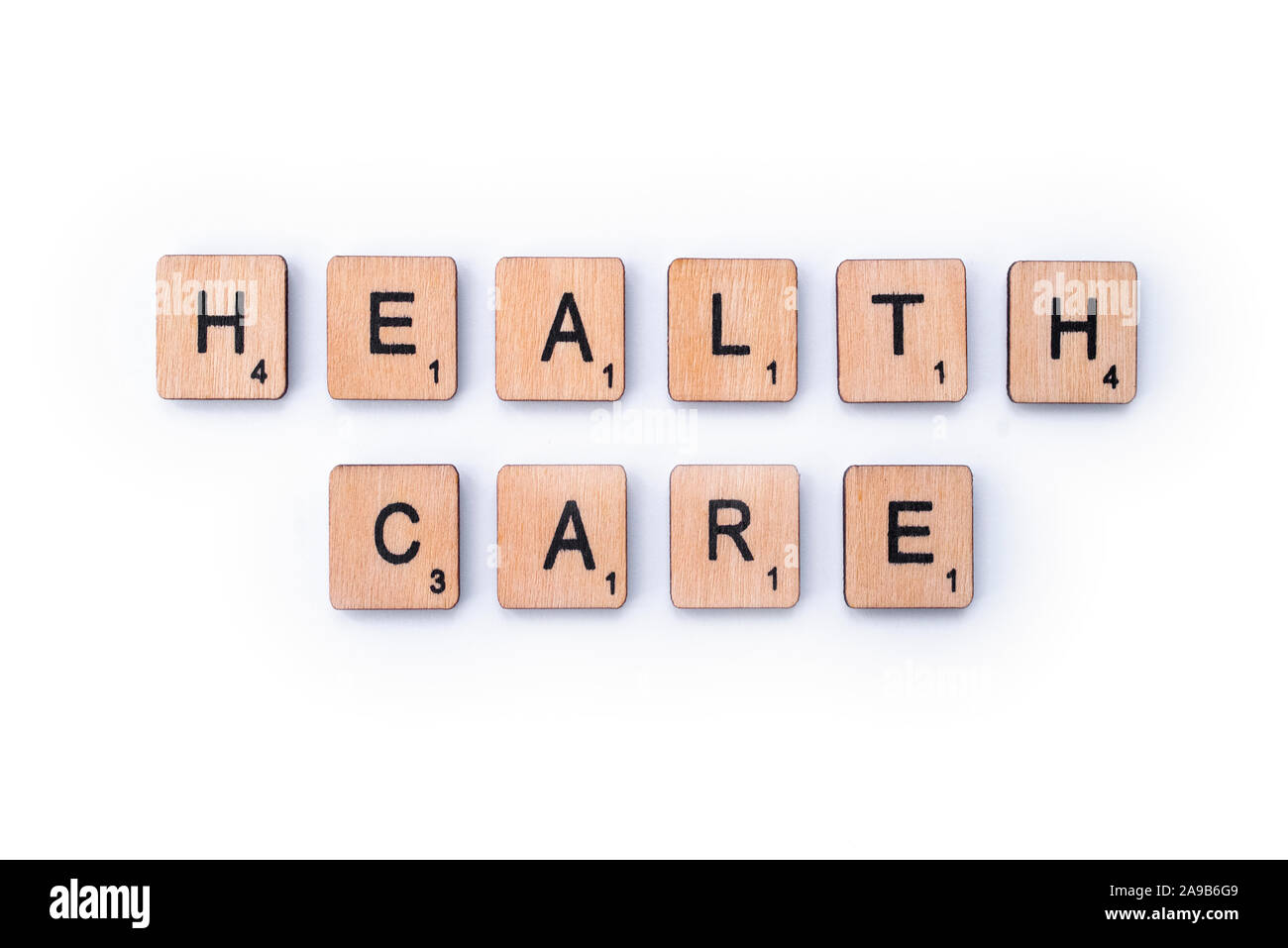 London, UK - February 6th 2019: HEALTH CARE, spelt with wooden letter tiles. Stock Photo