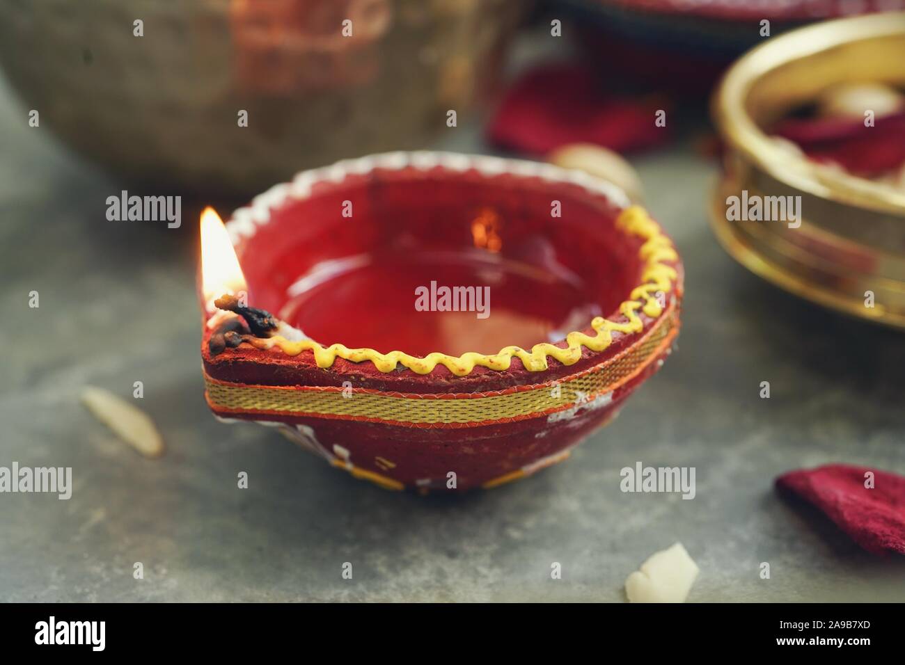 Happy Diwali background - Colorful Clay Diya lit during Deepavali festival, selective focus Stock Photo