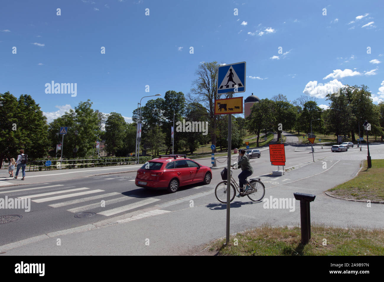 UPPSALA, SWEDEN ON JULY 03, 2019. View of signs and zebra crossing outside Carolina Rediviva. Unidentified persons. Editorial Stock Photo