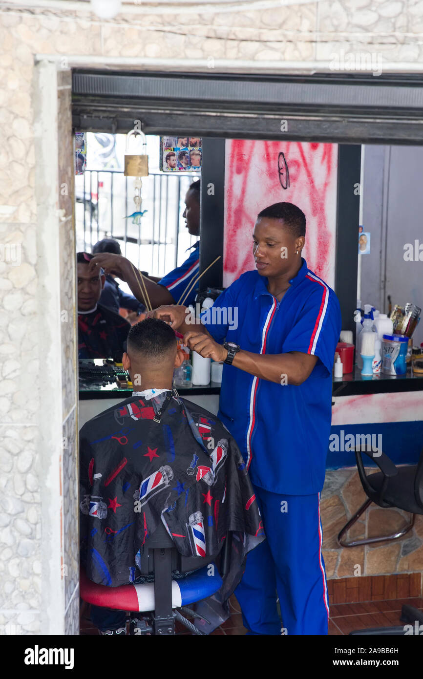 MEDELLIN, COLOMBIA - SEPTEMBER 12, 2019: Unidentified man having haircut at Medellin, Colombia. Medellin is capital of Colombia’s mountainous Antioqui Stock Photo